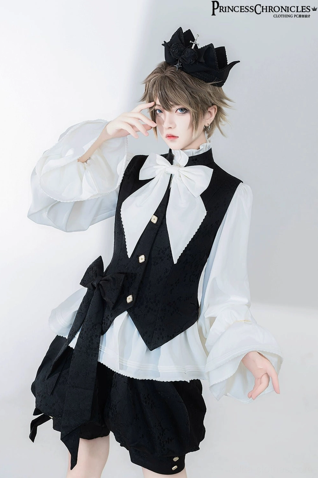 Ouji Lolita prince blouse worn on model demonstrating perfect fit and drape of dacron-spandex fabric with chain-cuffed sleeves