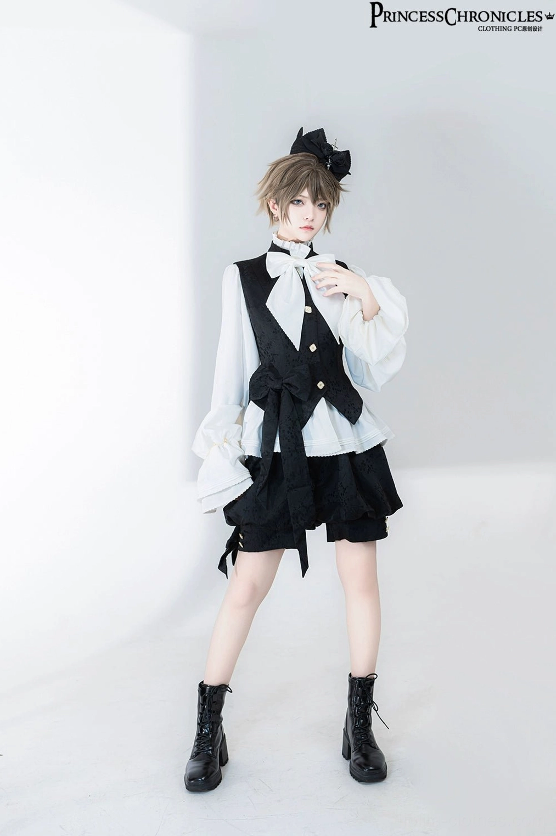 Full-body standing view of Ouji Lolita retro prince shirt with model posing at collar, matching black combat boots and crown-style bow hairpiece