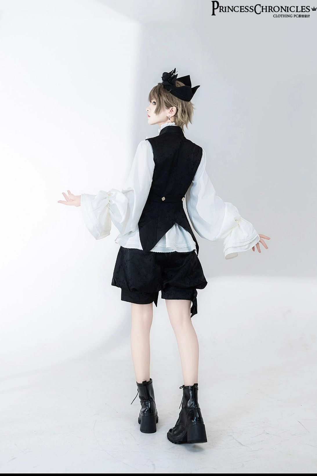 Back detail view of Hunting Rabbit Ouji prince shirt showing flowy bishop sleeves construction and rear waistcoat silhouette