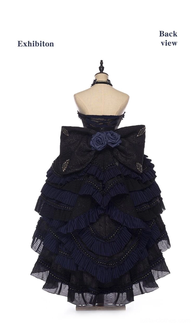 Gothic Lolita JSK Dress back view on dress form, large oversized decorative bow, halter neck open back design, tiered ruffled skirt layers, architectural back structure
