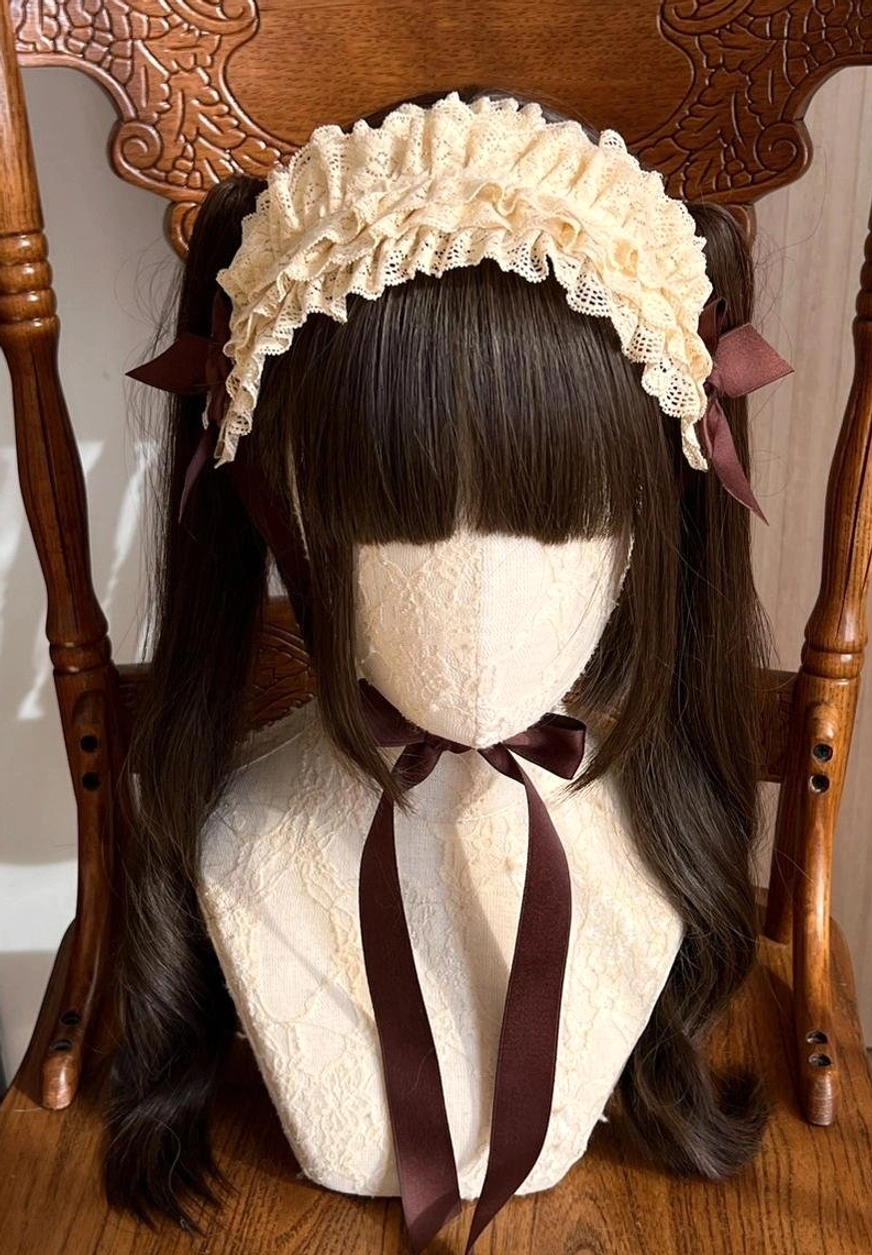 Ivory coffee two-tone lace KC headdress worn on mannequin with brown twin ponytails, showing elegant color contrast and coordination