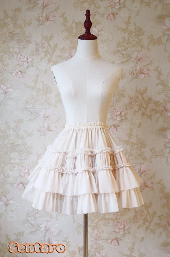Ivory cream beige tiered ruffle Lolita shorts skirt with layered hem detail, princess-like A-line profile front view