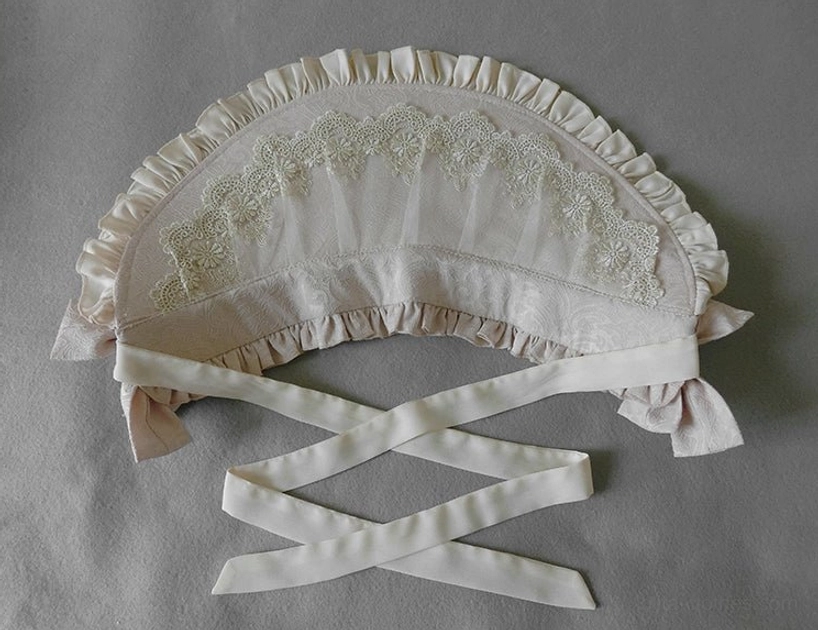 Front display ivory cream Lolita bonnet lace brim ruffled edge cross-style ribbon ties headdress