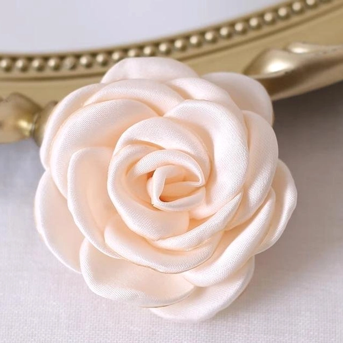 Ivory fabric rose brooch and hair clip accessory showcasing ethereal beauty and pearlescent satin finish for Lolita fashion styling