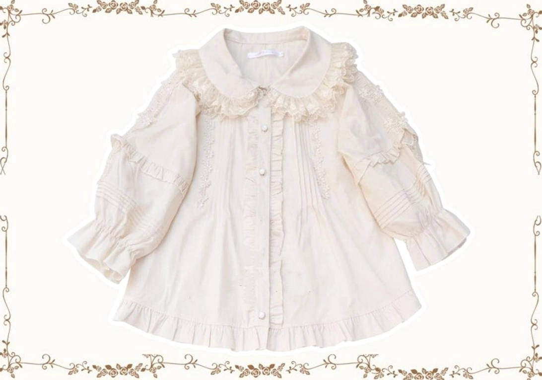 Beige ivory Lolita blouse with ruffled lace Peter Pan collar, vertical pintuck panels, and A-line silhouette displayed in studio flat lay