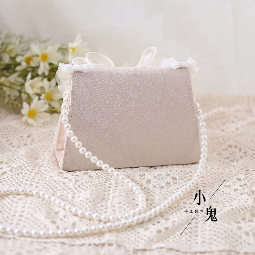 Ivory lolita tea party handbag showcasing delicate lace pattern and ivory-pink color harmony vintage aesthetic