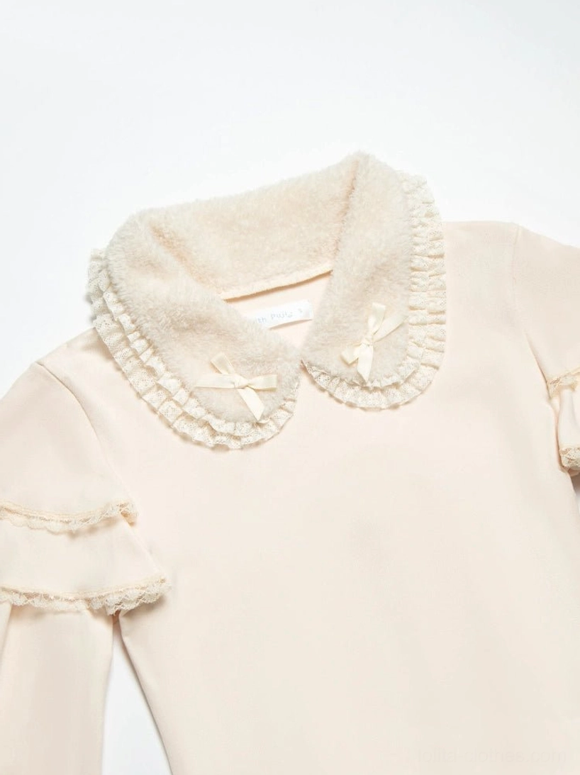 Ivory lolita knit sweater back view detail showing fitted waist construction and ruffled sleeve design on mannequin