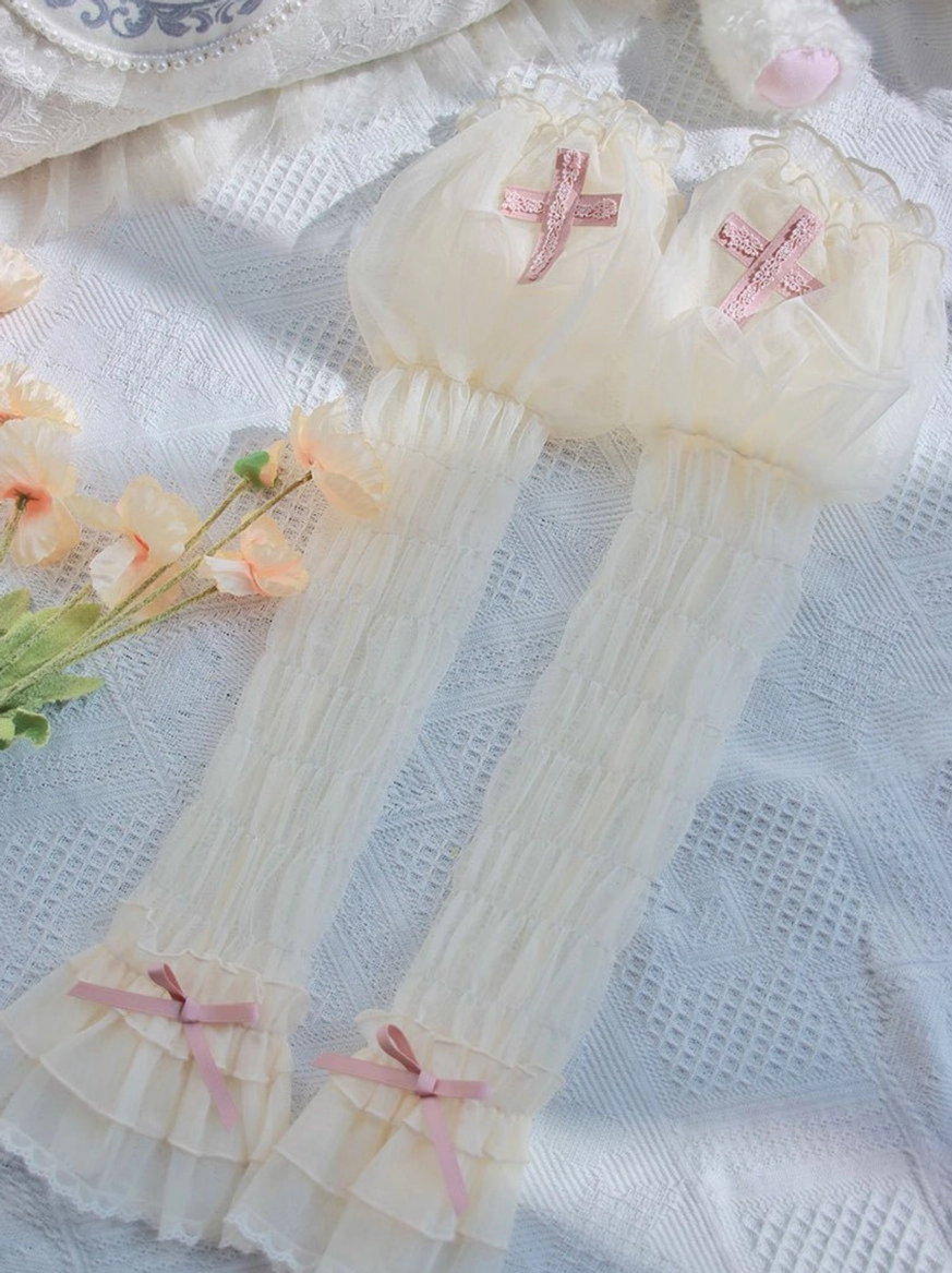Cream white Gothic Lolita arm sleeves with pink cross accents, sheer mesh fabric and satin ribbon bows, matched with peach tulips on white lace background