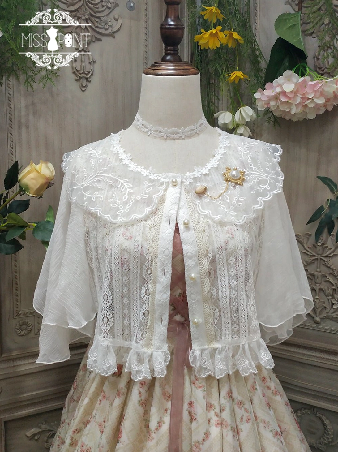 ivory short sleeve retro lolita blouse with lace lapel and pearl buttons front view on dress form