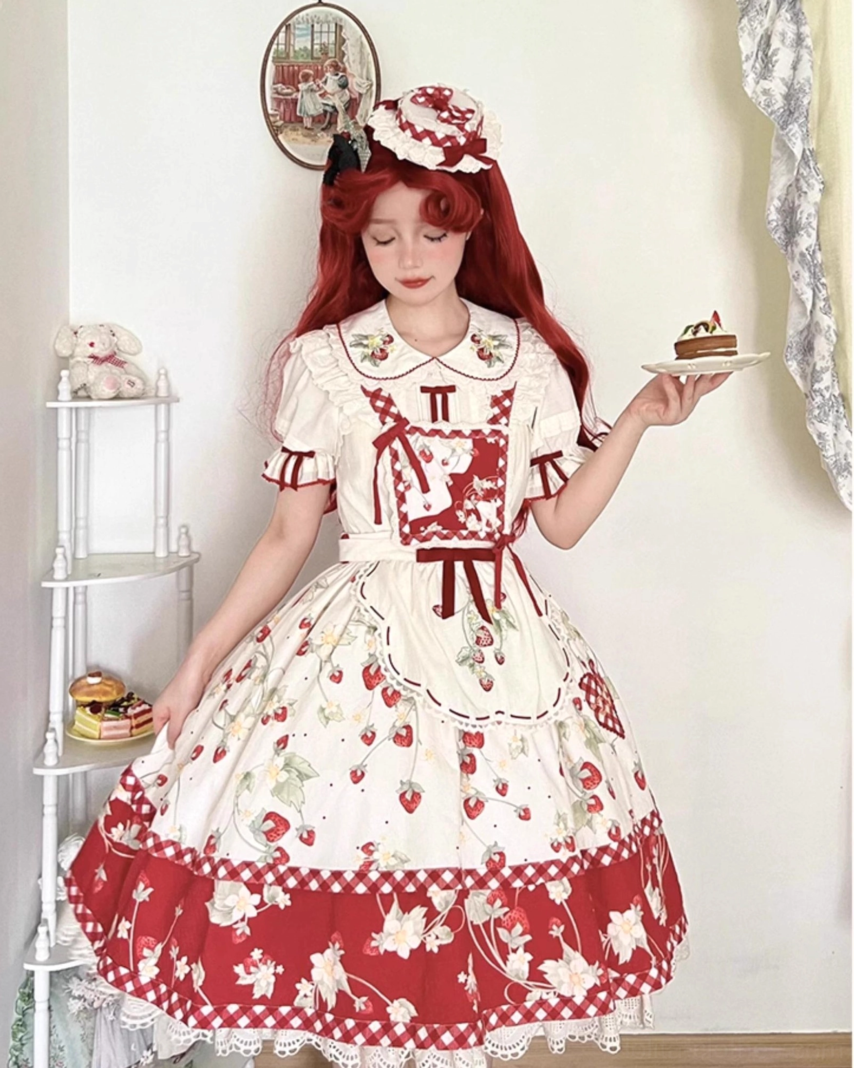 Flat lay product shot of ivory strawberry embroidered sweet lolita blouse showing overall silhouette color and construction quality