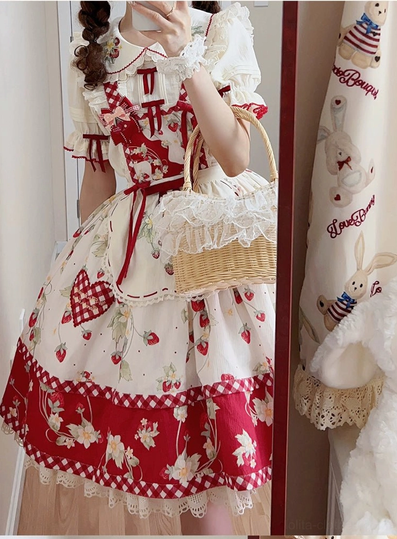 Ivory sweet lolita blouse with strawberry embroidery and removable red ribbon bows detail shot showing Peter Pan collar front view