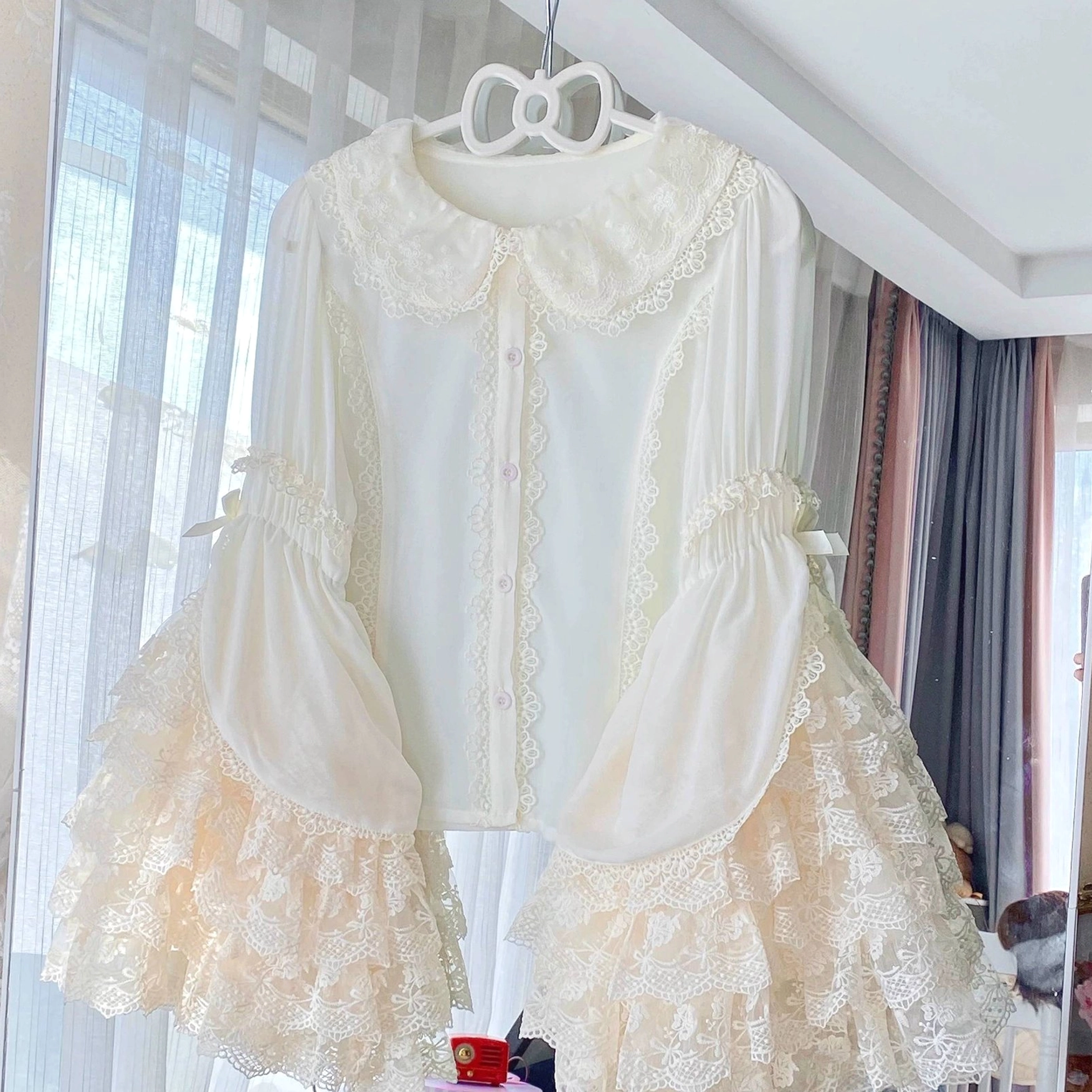 Cream ivory Sweet Lolita lace blouse Peter Pan collar layered ruffle trumpet sleeves hanging display