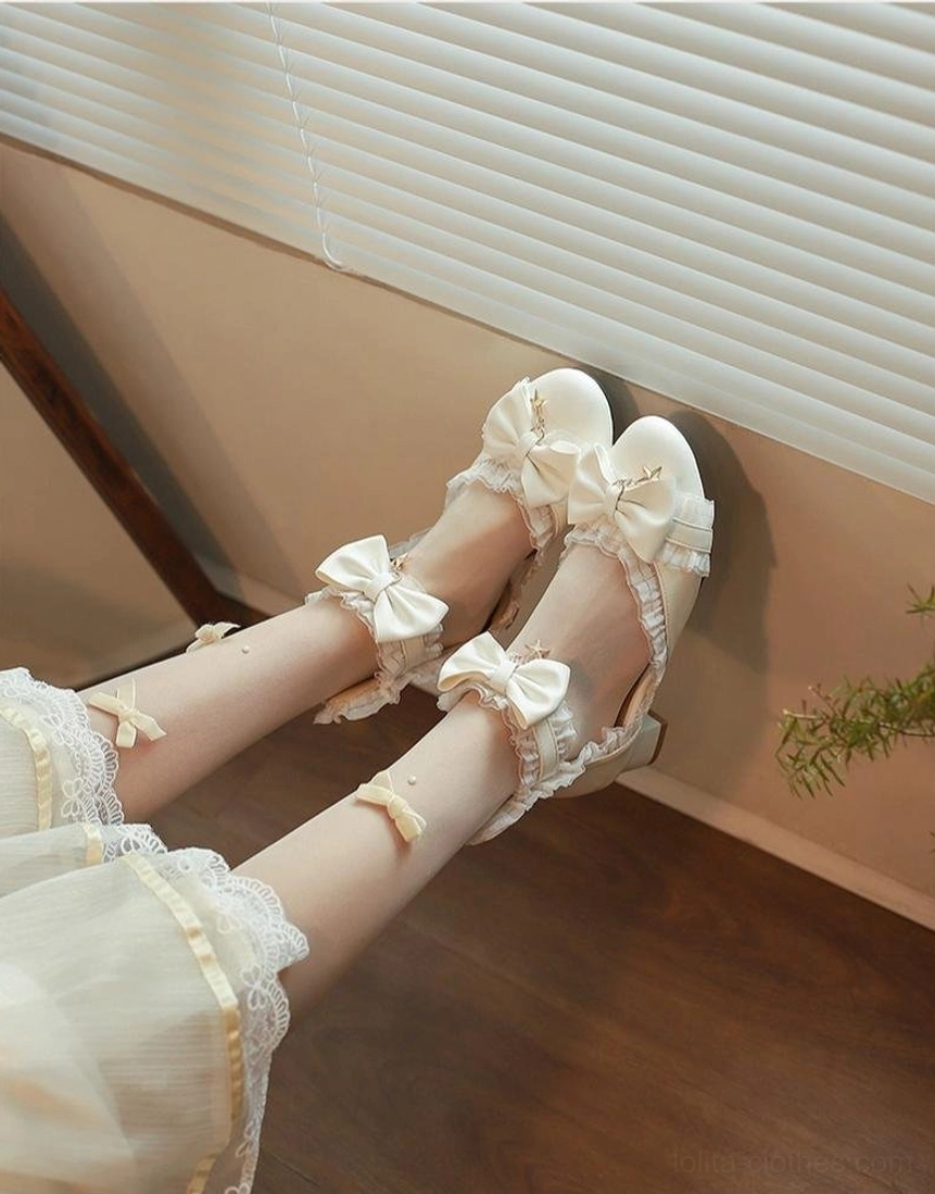 Ivory Sweet Lolita Mary Jane shoes overhead side view showing dual decorative bows on straps and ruffled lace trim on model with window blind backdrop