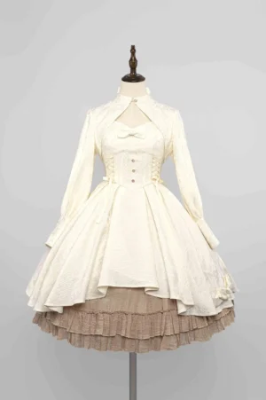Ivory white Gothic Lolita two-piece set featuring long-sleeve bolero jacket and JSK dress with corset front detailing, cutout stand collar neckline, and layered ruffled jacquard underskirt on dress mannequin