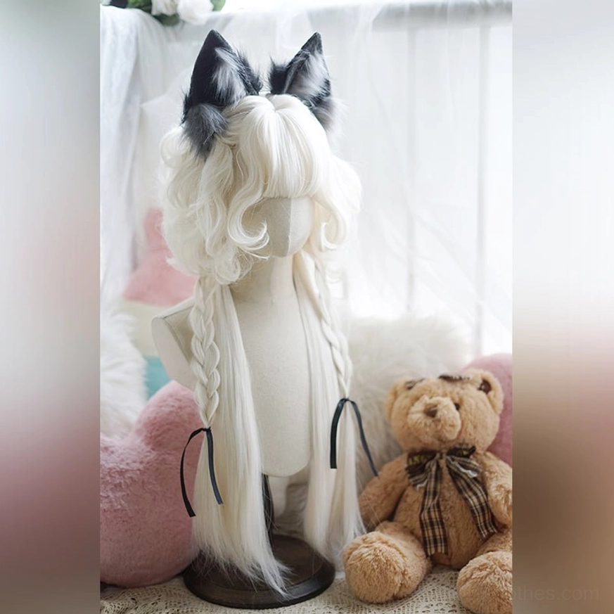Jellyfish lolita wig profile view displaying layered curly construction, braid flow, and velvet bow accent from side perspective