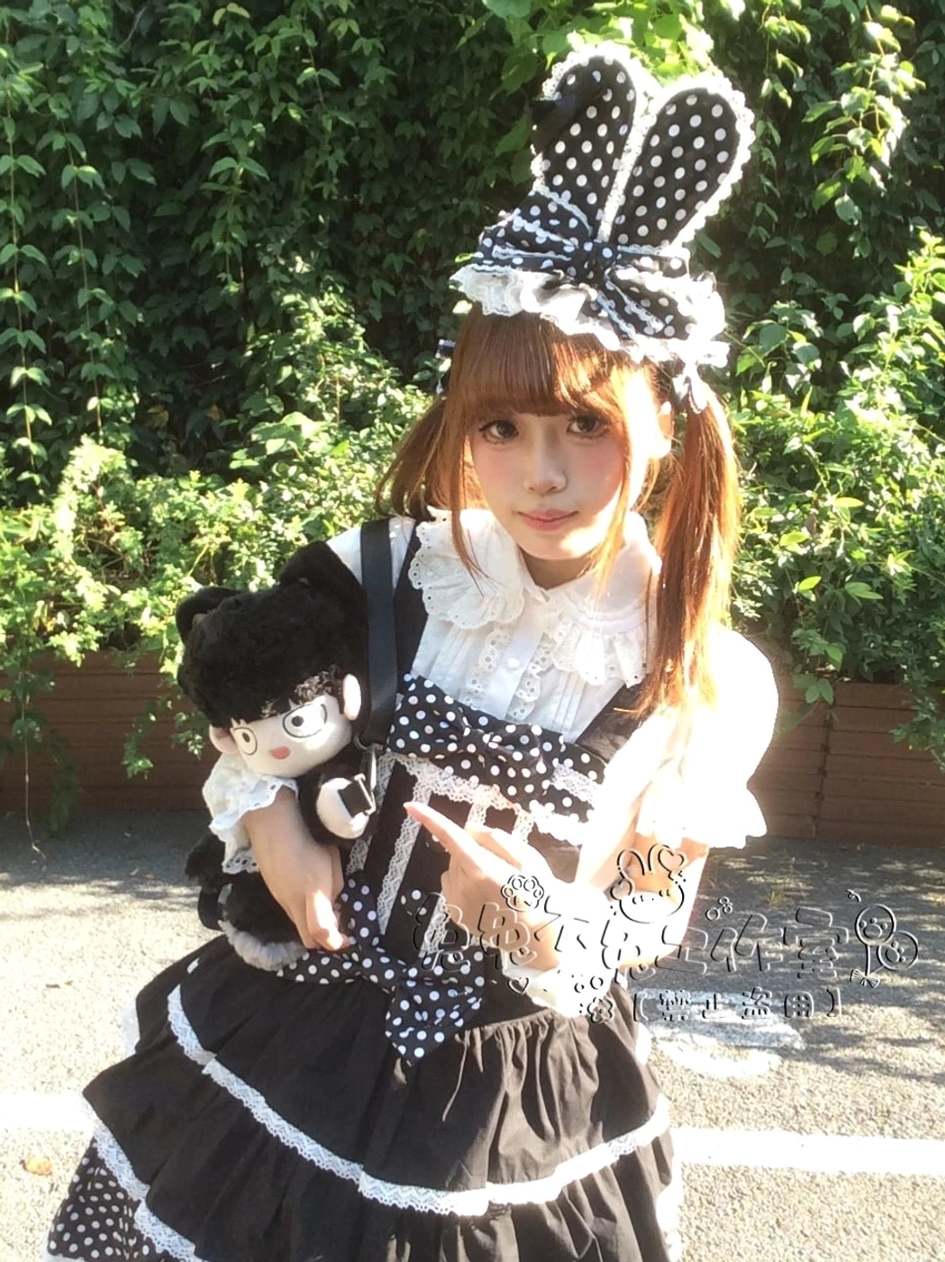 Kawaii Lolita bunny ear hair clip headdress product detail shot showing lace trim craftsmanship ribbon bow and pom-pom embellishment construction quality