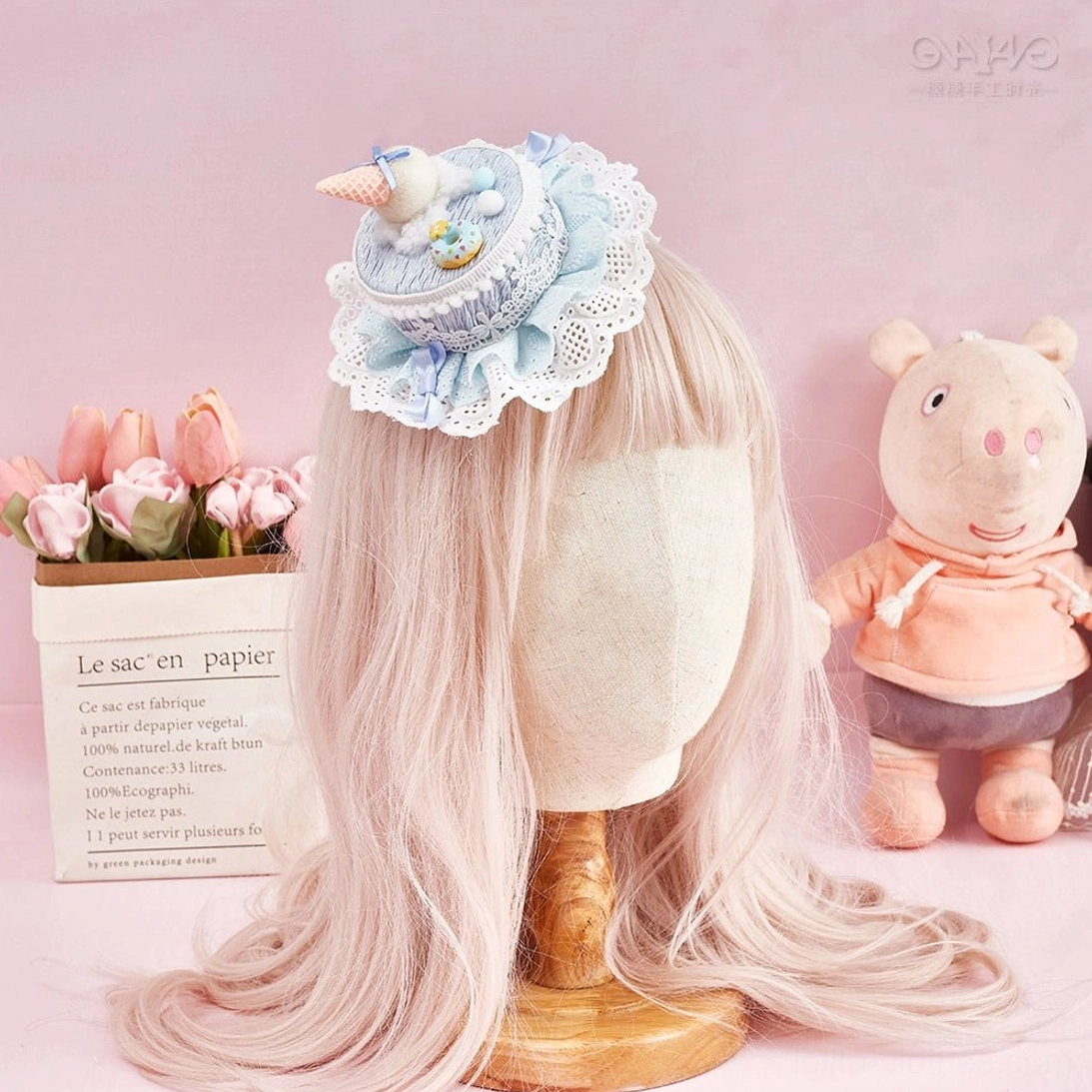 Kawaii Lolita hair clip accessory with whimsical cake design and delicate decorative elements on elegant background