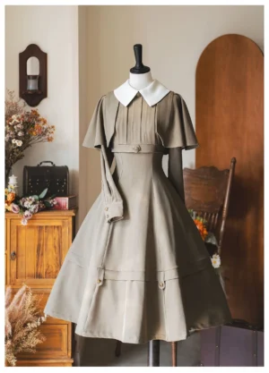 Front full view khaki beige classic lolita one-piece dress with detachable short cape contrast white collar long sleeves pleated bust A-line skirt decorative trim