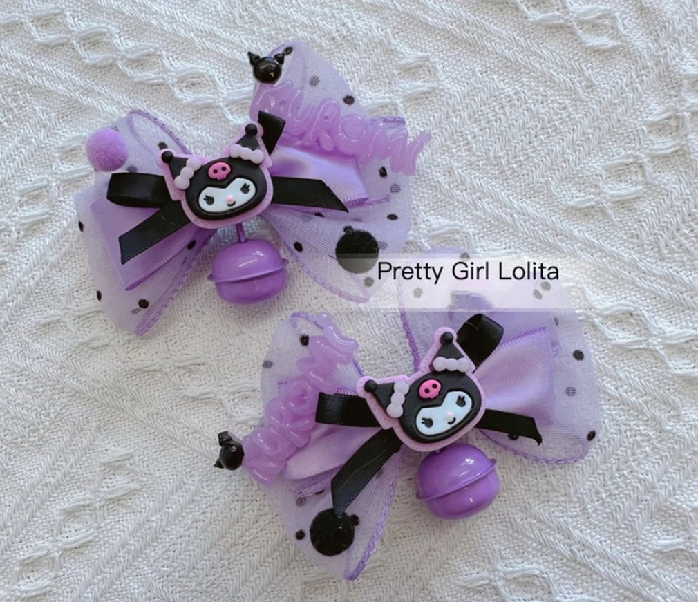 Kuromi themed bow hair clips set of 2 sheer purple polka dot tulle cartoon badges matching bell decorations flat lay