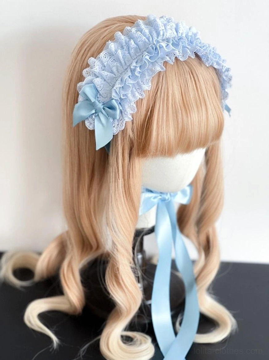 Elastic band and fish-mouth clip fastening system detail of lace KC headdress showing security mechanism and adjustment features