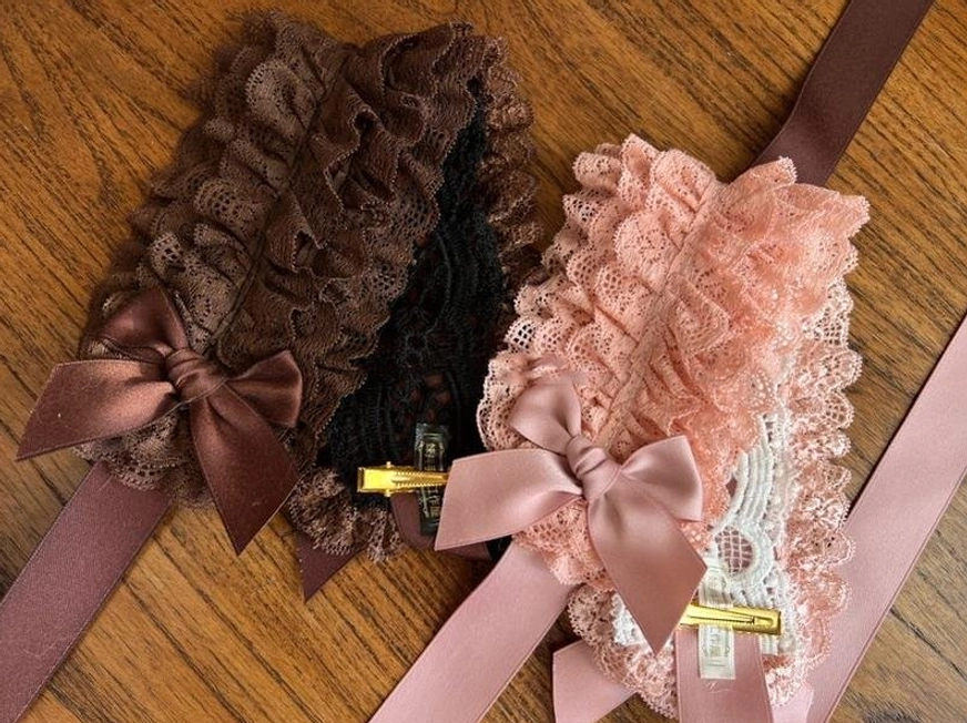 Detailed texture close-up of premium nylon lace used in KC headdress construction showing fine weave quality and drape characteristics