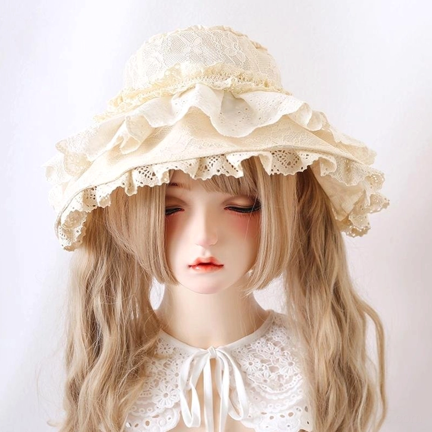 Beige multi-layered eyelet lace Lolita sun hat close-up, front view on BJD mannequin highlighting intricate lace ruffles and romantic Victorian-inspired design