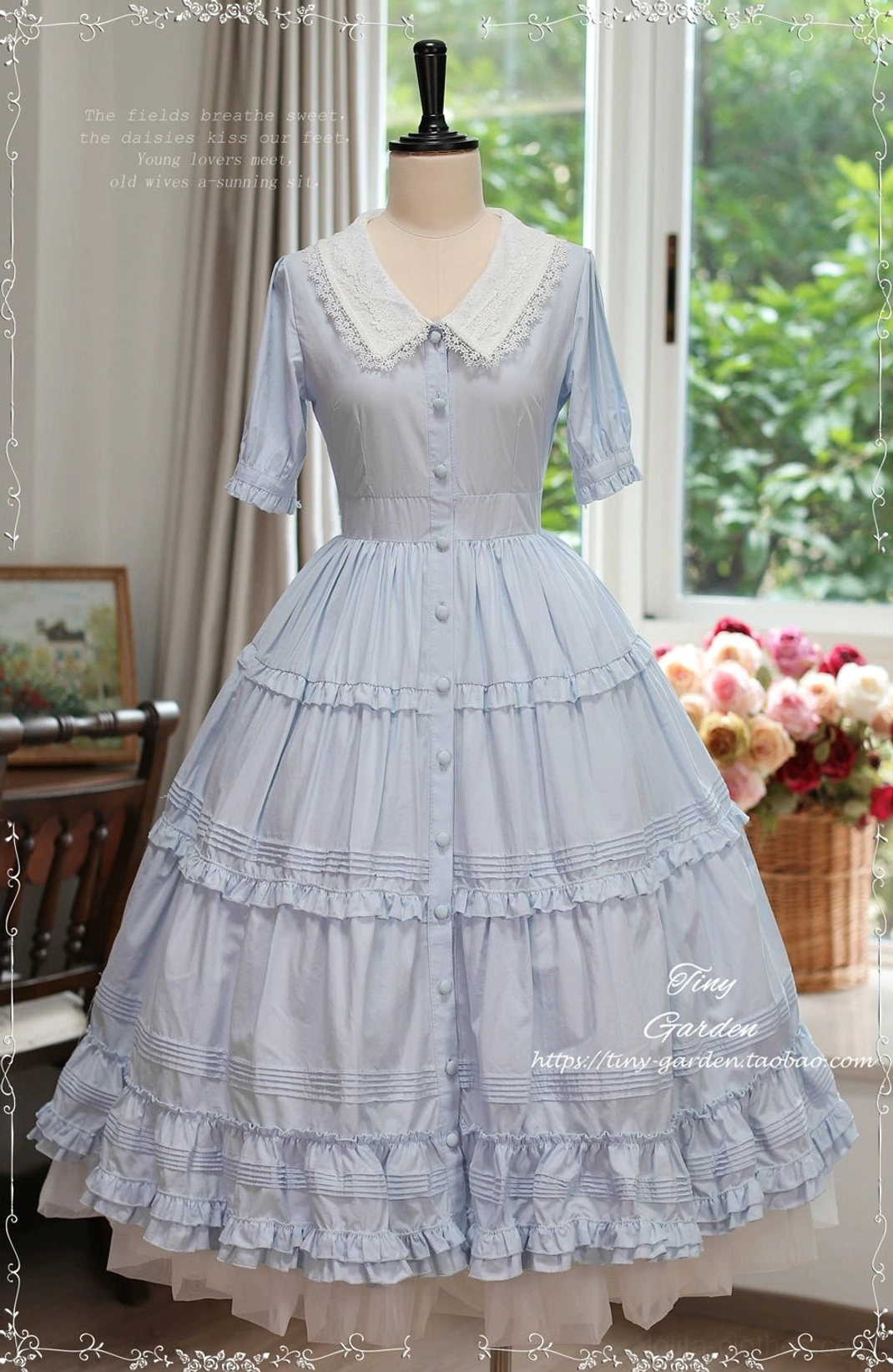 Dusty light blue Lolita OP dress with button-front closure and intricate lace detailing, showcasing full-length tiered ruffle skirt vintage studio setting