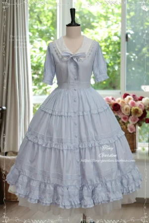 Light blue classic Lolita OP dress with lace collar and detachable dogtooth bow, featuring tiered ruffled floor-length skirt and half sleeves on dress form