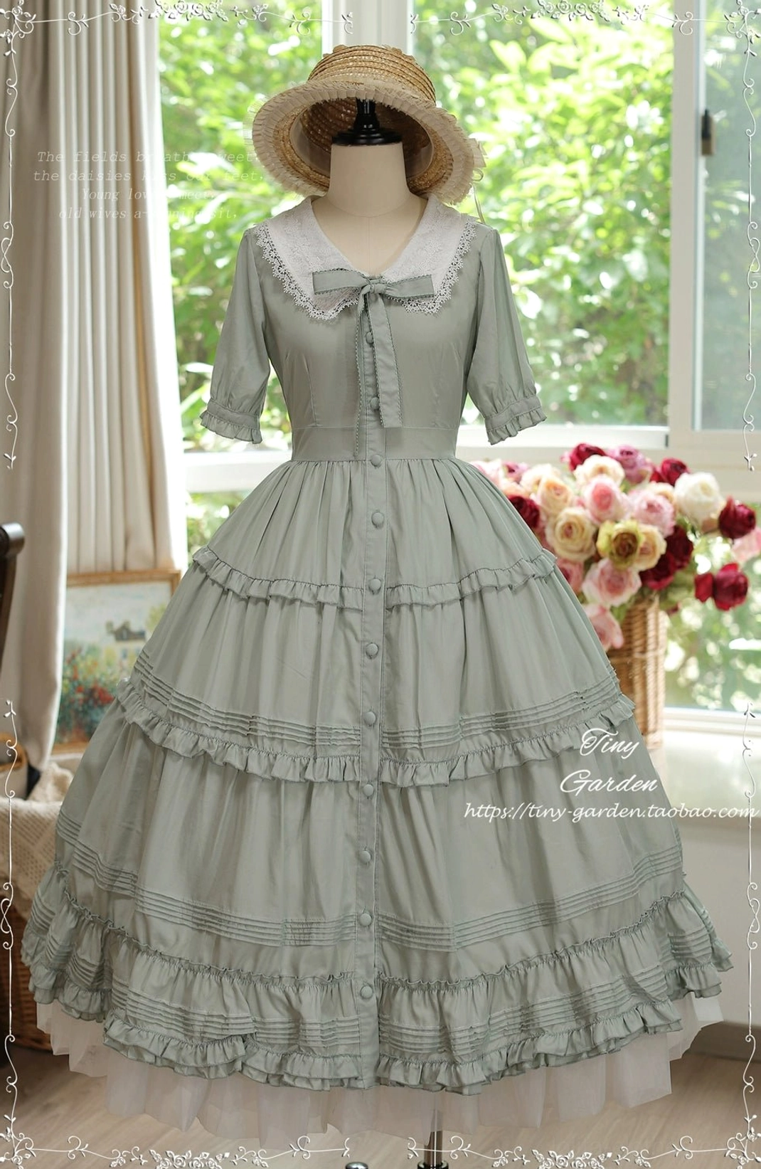 Sage green classic Lolita OP dress with delicate lace collar and front dogtooth bow, featuring full tiered ruffled floor-length skirt on dress form