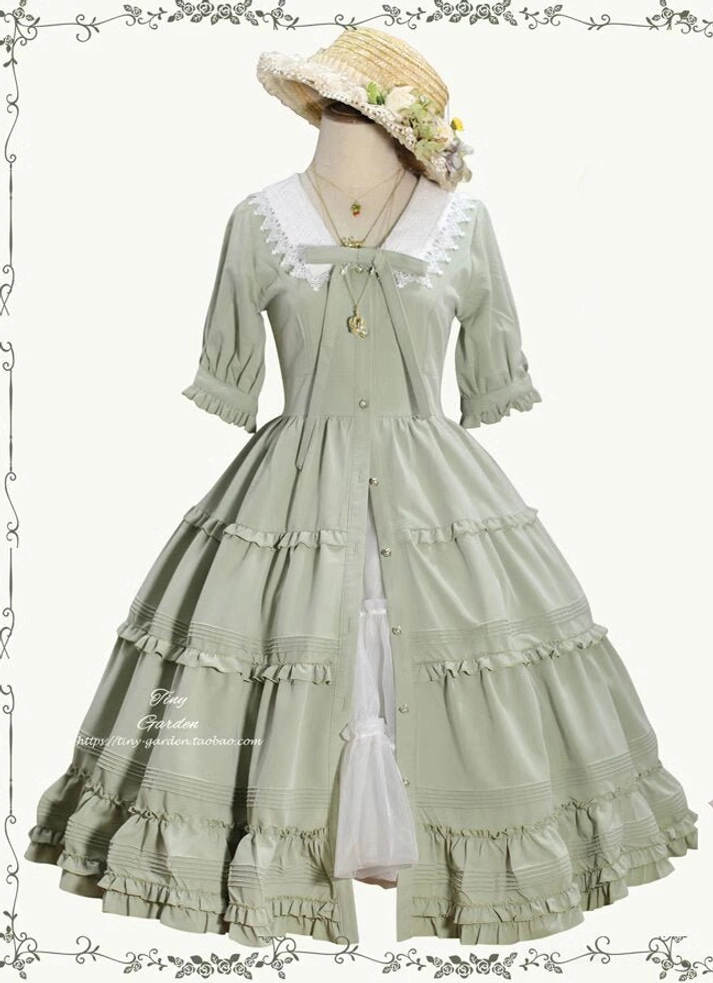 Sage green open-front Lolita OP dress with flower-decorated straw hat and gold necklace, lace doll collar with tiered ruffled floor-length skirt