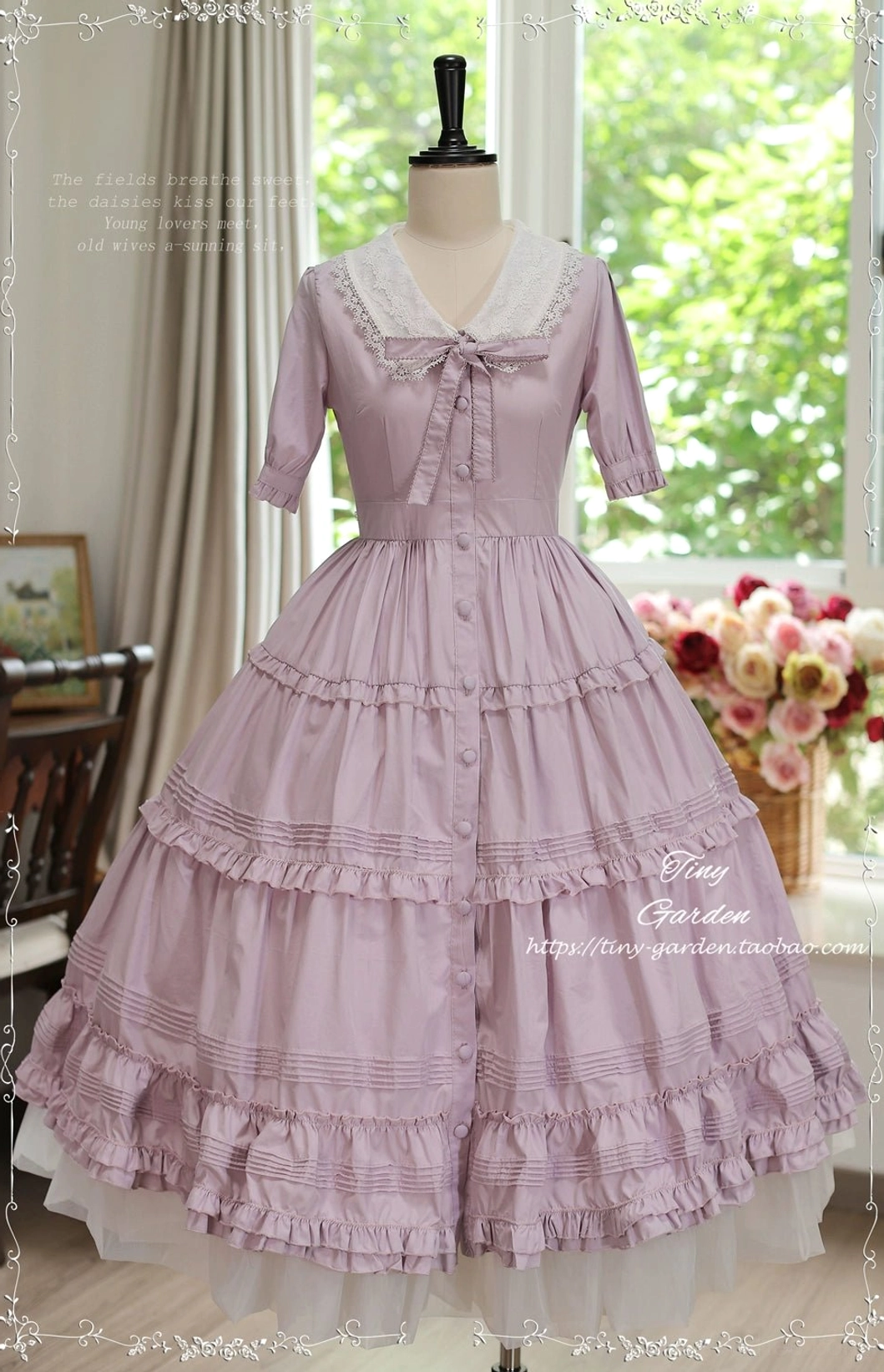 Sakura pink classic Lolita OP dress with removable lace collar and dogtooth bow accent, full floor-length tiered ruffle design on mannequin