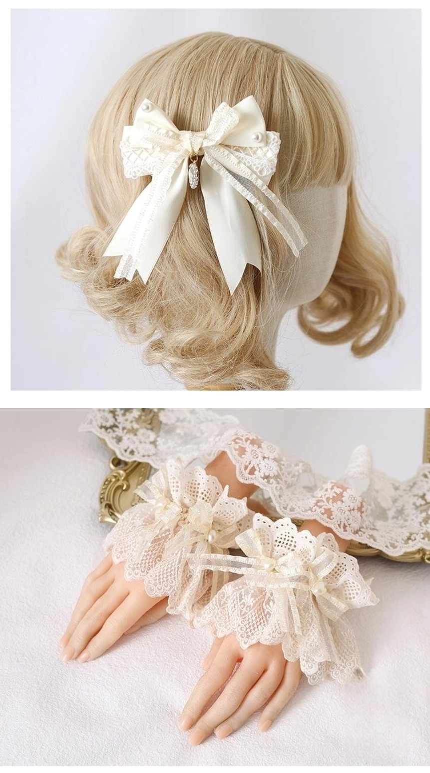 Large layered ivory satin bow hair clip with multi-tier ribbon structure back view close-up on blonde wig mannequin