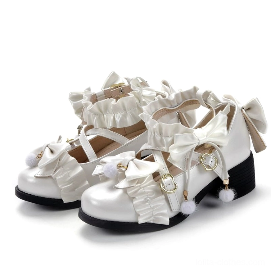 Laser blue mid-heel Lolita Mary Jane shoes with butterfly pom-pom bows, front perspective view highlighting round toe shape and cross ankle strap design