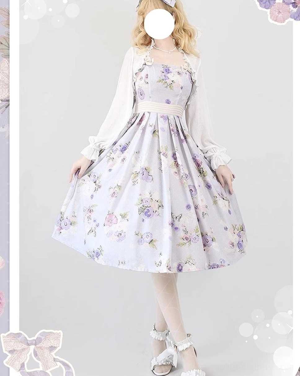 Lavender floral lolita JSK dress with romantic purple flower prints, matching waist sash, styled with white sheer long-sleeve outer blouse, comfortable flared midi skirt full body front view