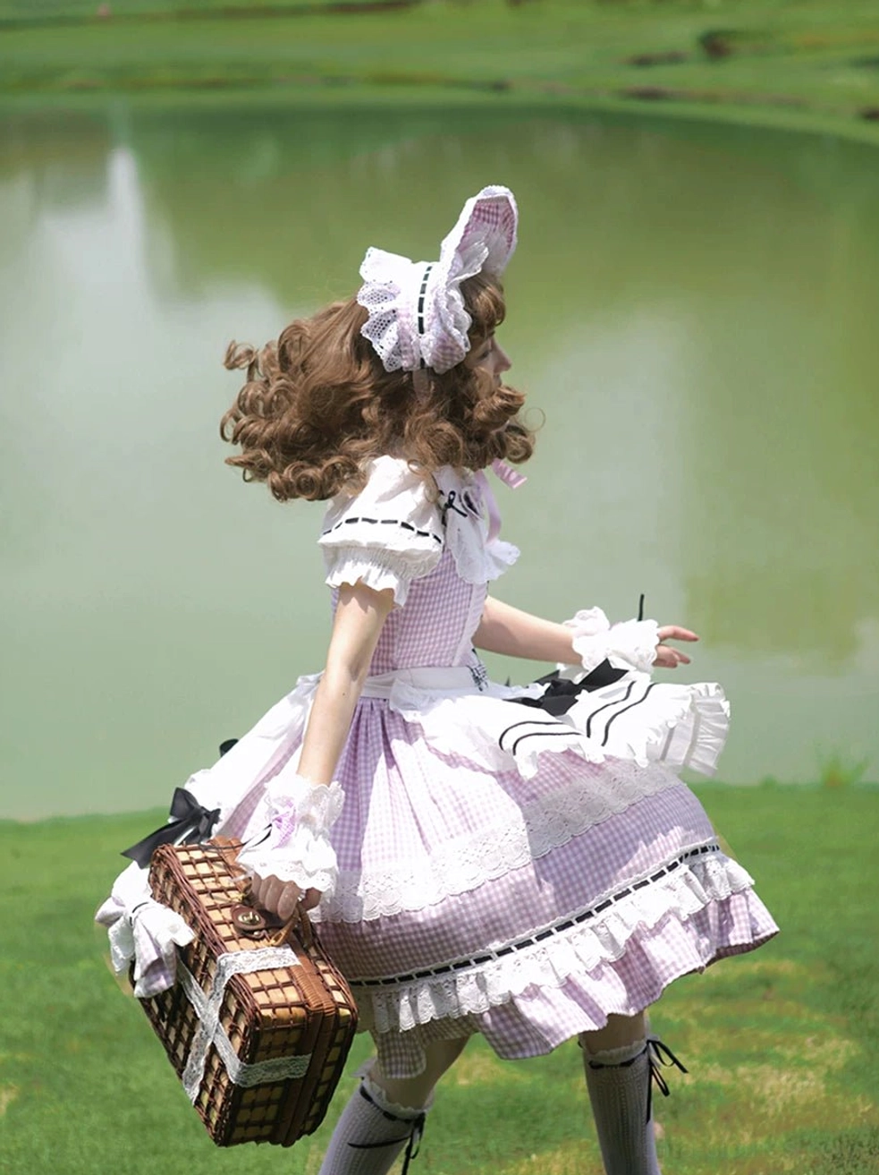 Lavender gingham Lolita JSK dress matching bonnet back three-quarter view flounced skirt lakeside outdoor
