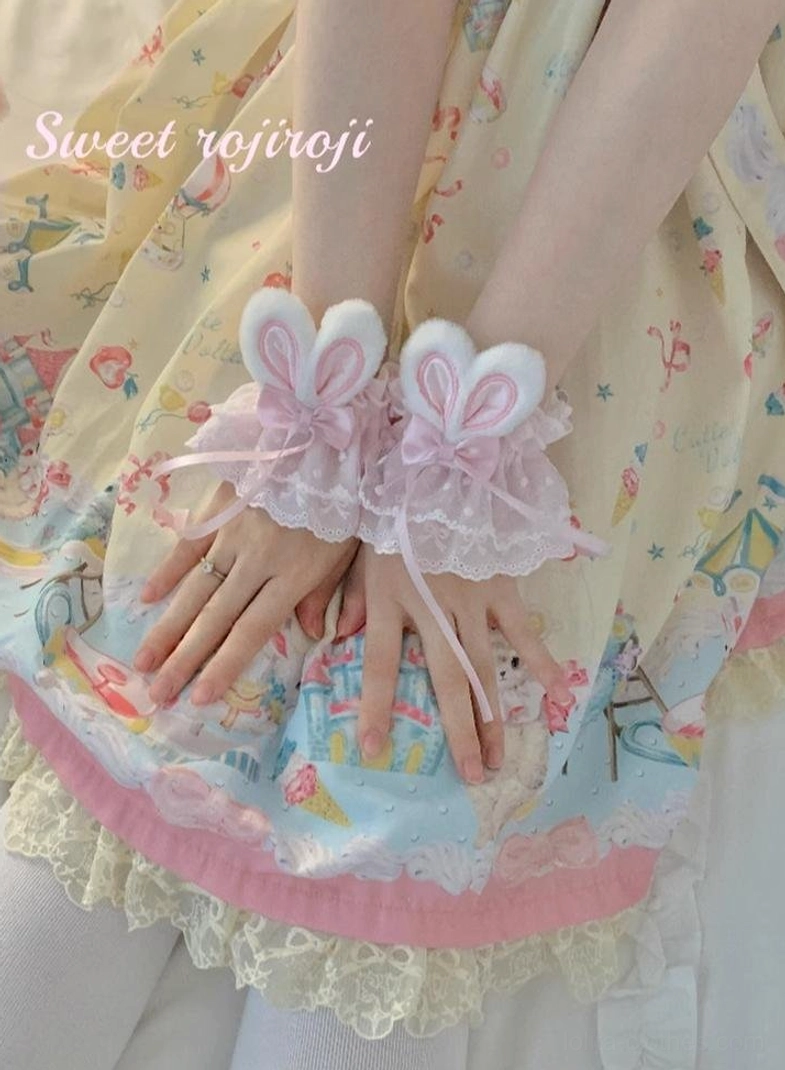 Lavender pink gradient rabbit ear lace wrist cuffs with satin bow and ribbon tails worn with ruffled Lolita dress