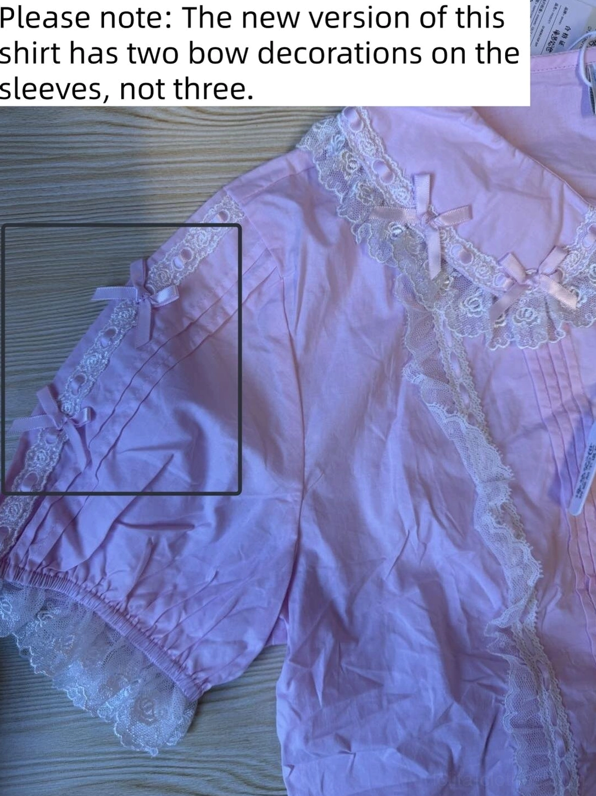 Lavender purple lolita lace blouse close-up flat lay showing lace trims on sleeves and body with two bow details