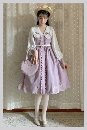 Lavender purple Lolita one-piece dress with white ruffled long sleeves contrasting front button closure and scalloped skirt hem embroidery details