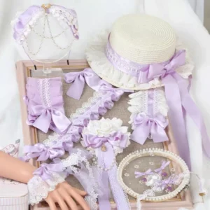 Complete lavender sweet lolita accessory set flat lay display including straw hat with lace trim satin bow wrist cuffs heart-shaped hair clips hairband and back clips arranged on wooden tray with simulated hand model showing authentic lolita fashion styling