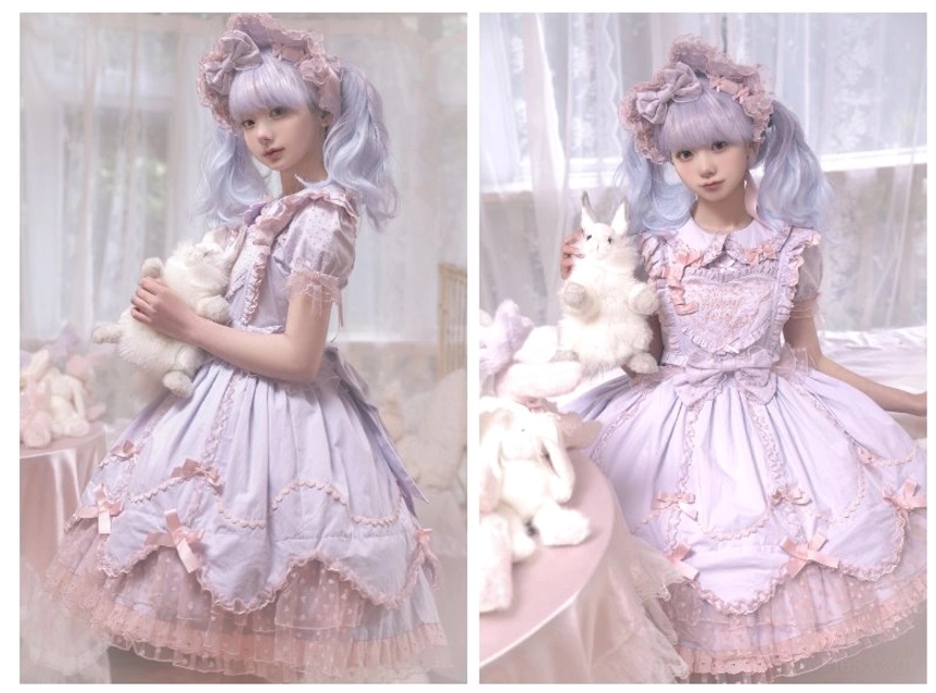 Lavender vintage Lolita jumper dress with layered ruffled skirt sitting on bed with plush rabbit toy prop