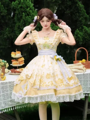 Front full-body view of yellow lemon and bear printed classic lolita OP dress with square ruffled neckline, puffed short sleeves, white lace hem, and matching waist belt worn at outdoor afternoon tea party setting