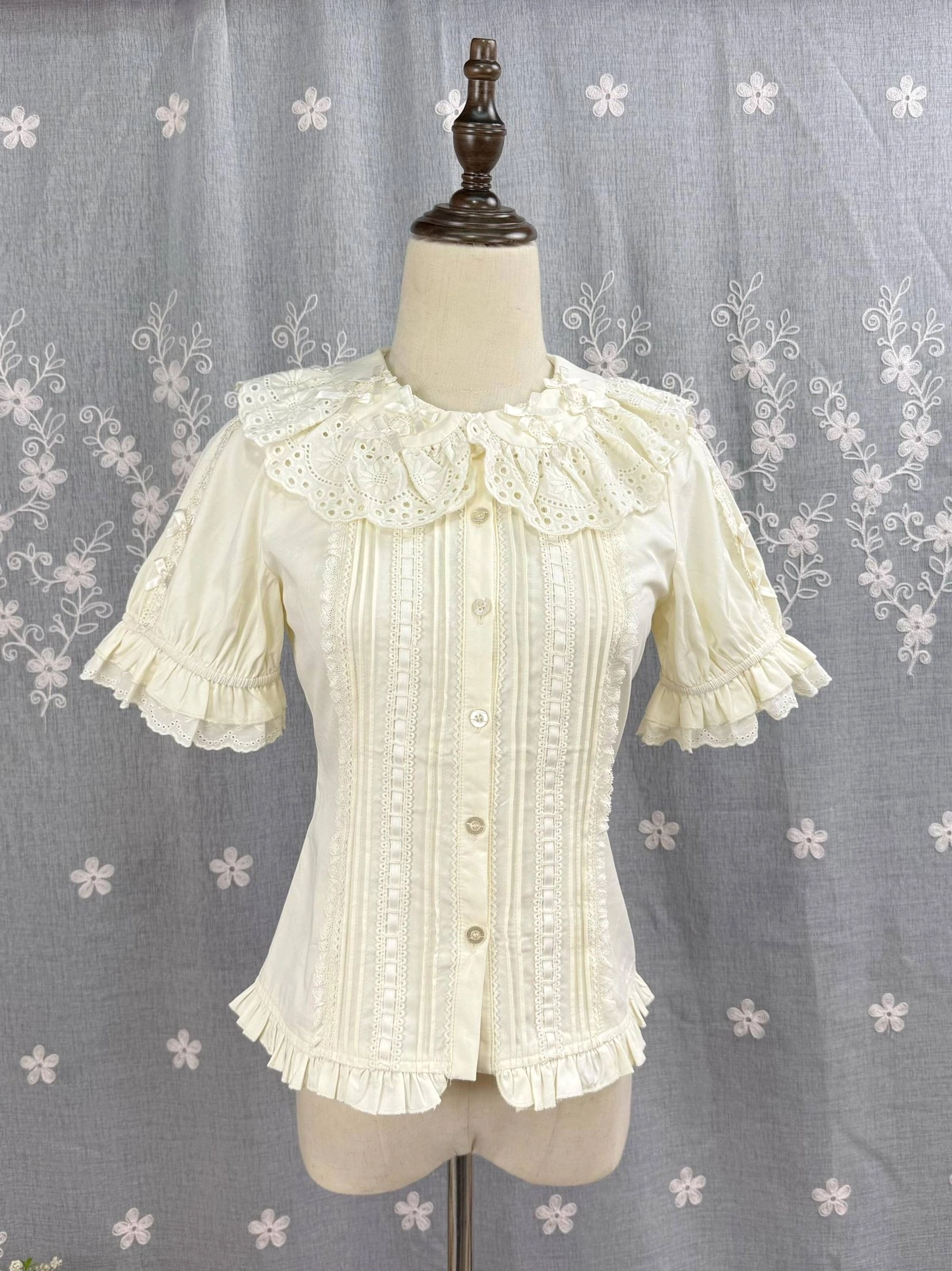 Light apricot Sweet Lolita Peter Pan collar blouse front flat display with hollow embroidered ruffled neckline pleated trims