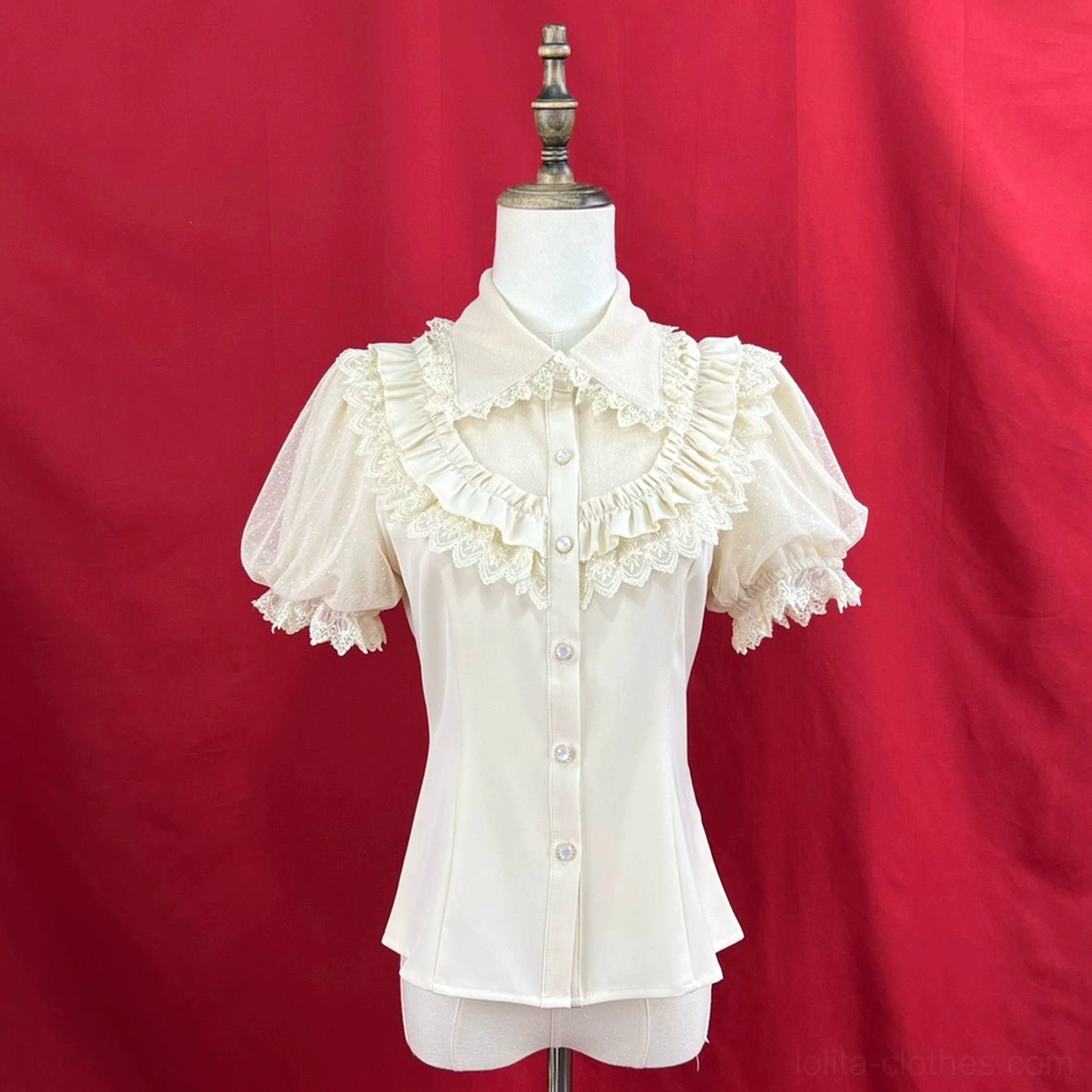 Light beige short-sleeve sweet lolita blouse peter pan collar front button placket chest ruffled lace trim short puff sleeves slim fitted cut on dress form red studio background