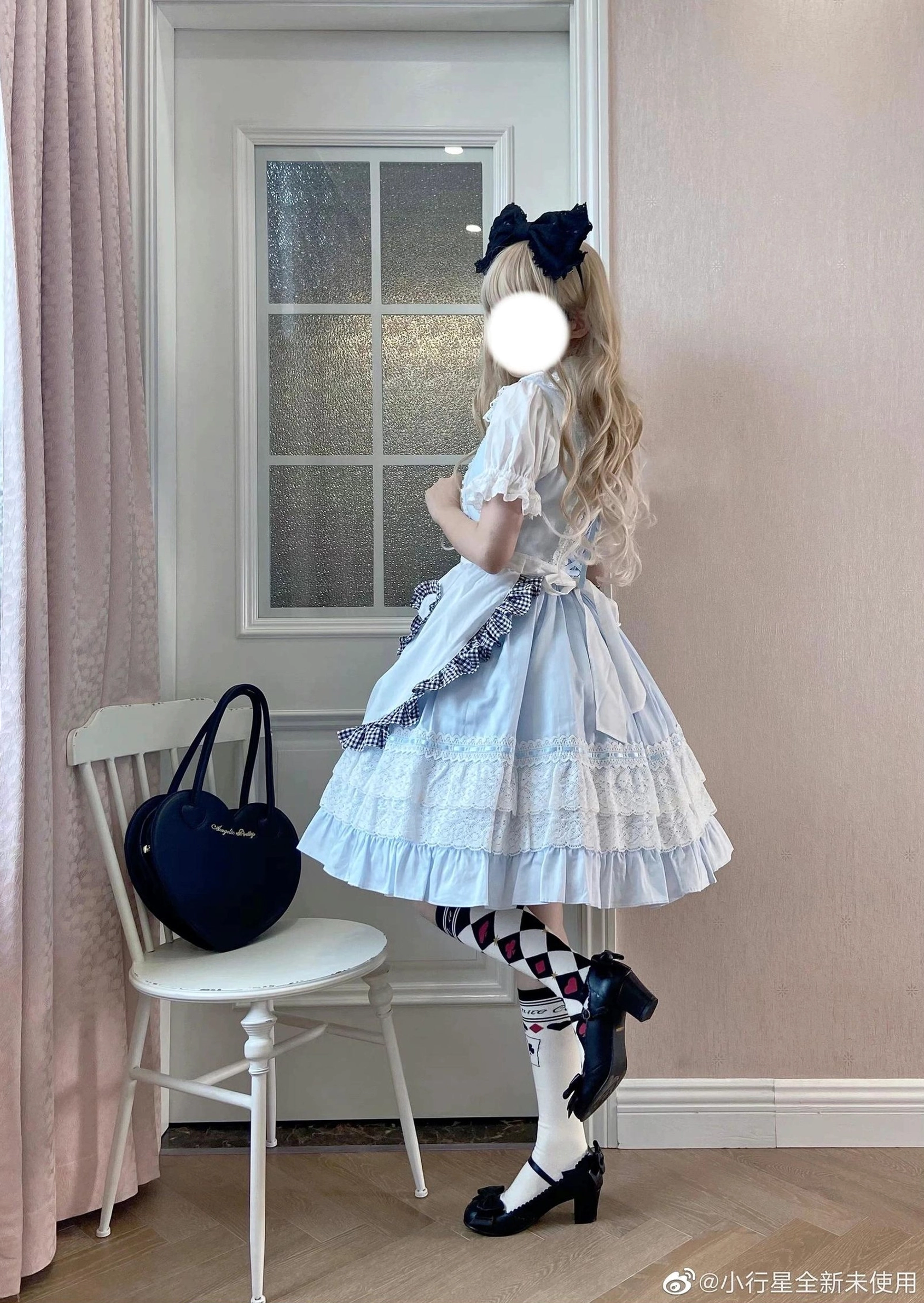 Asymmetric checkerboard and poker print light blue lolita cotton over-the-knee socks side view with French window indoor scene Alice dress
