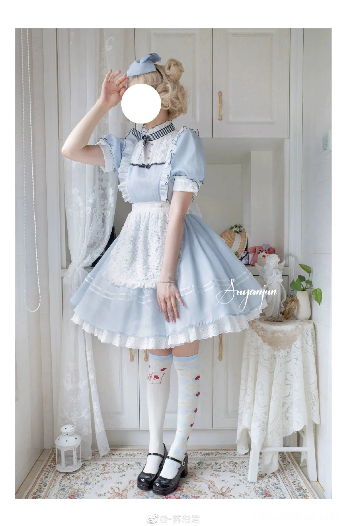 Light blue asymmetrical print mid-calf poker suit lolita cotton socks full body standing pose with maid hair accessory and classic Alice dress