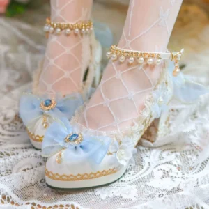 Blue bridal lolita high heel shoes worn on model's feet, featuring pearl ankle chain, gem-embellished blue bow, platform block heel - close-up front view