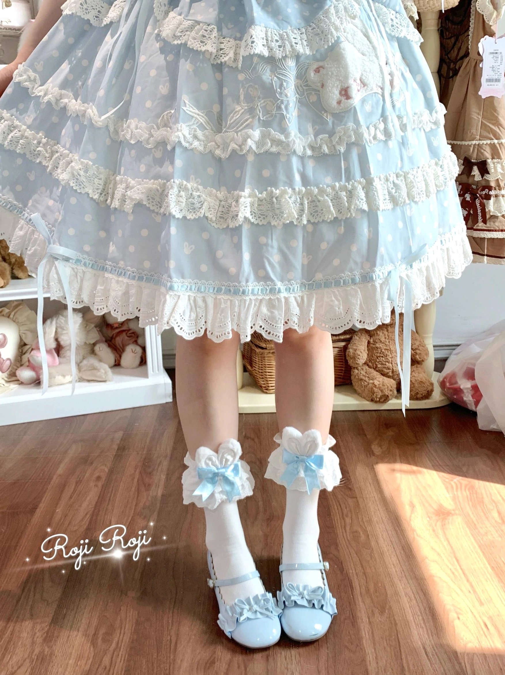 Light blue sweet lolita socks worn on model with blue frilled lace lolita skirt blue Mary Jane shoes ruffled lace bunny ear trim