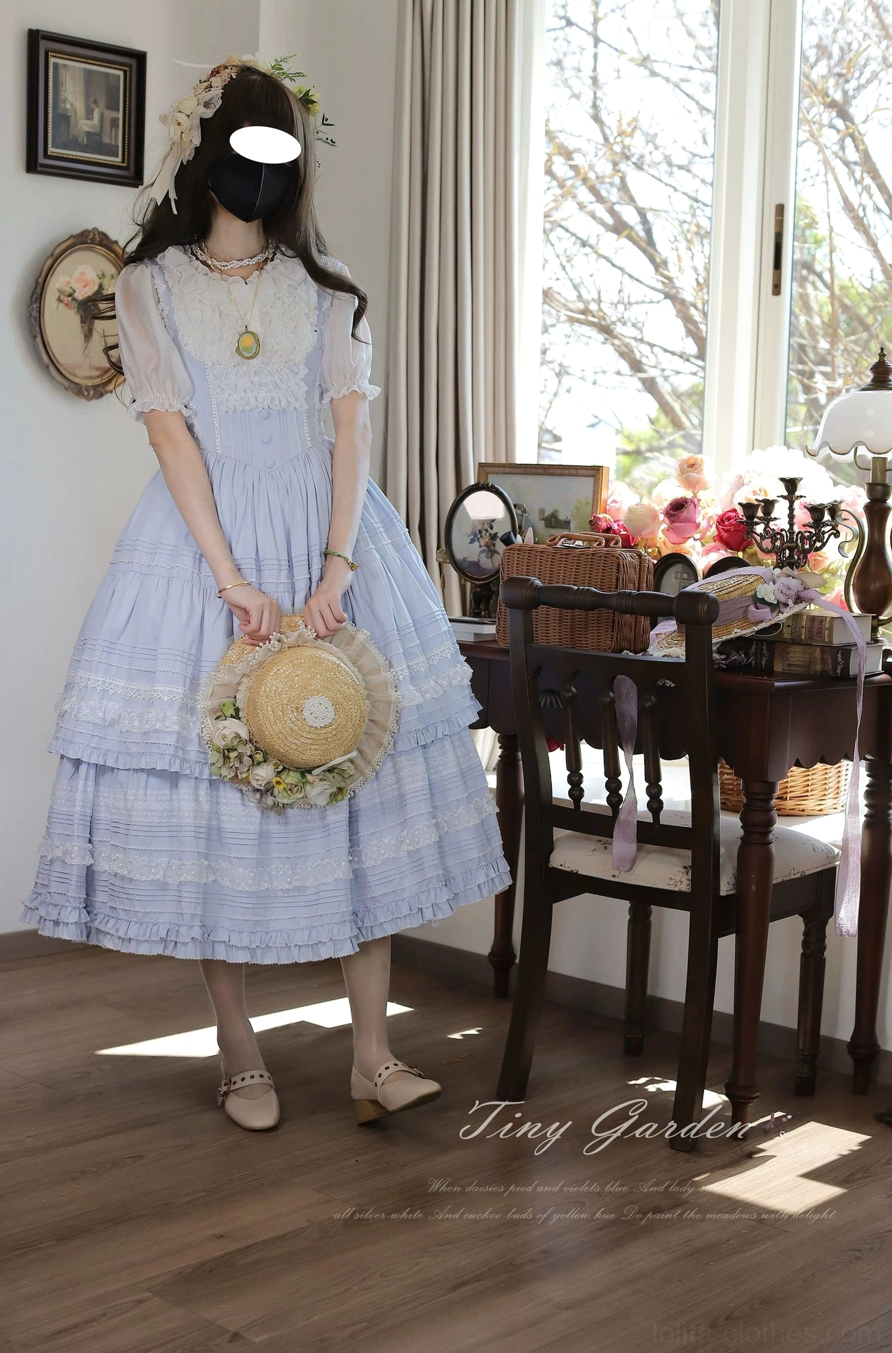 Light blue classic lolita bust-supporting JSK dress with corset fitted waist, layered lace-trimmed midi skirt, and vintage pendant necklace - front full-body shot with flower hair accessory
