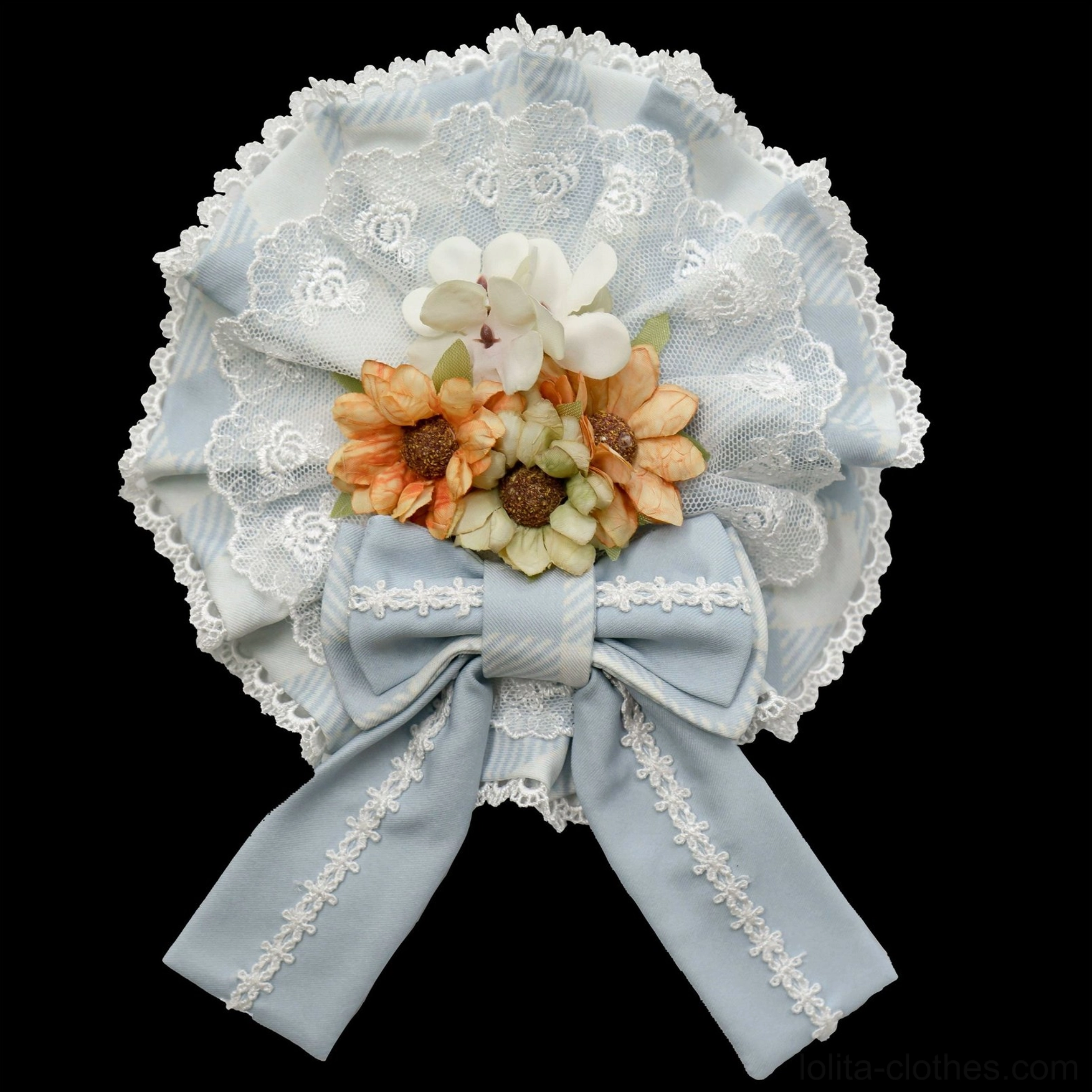 Light blue round lace sweet lolita flower brooch flat lay with artificial sunflower bouquet satin bow and white lace trim on black background