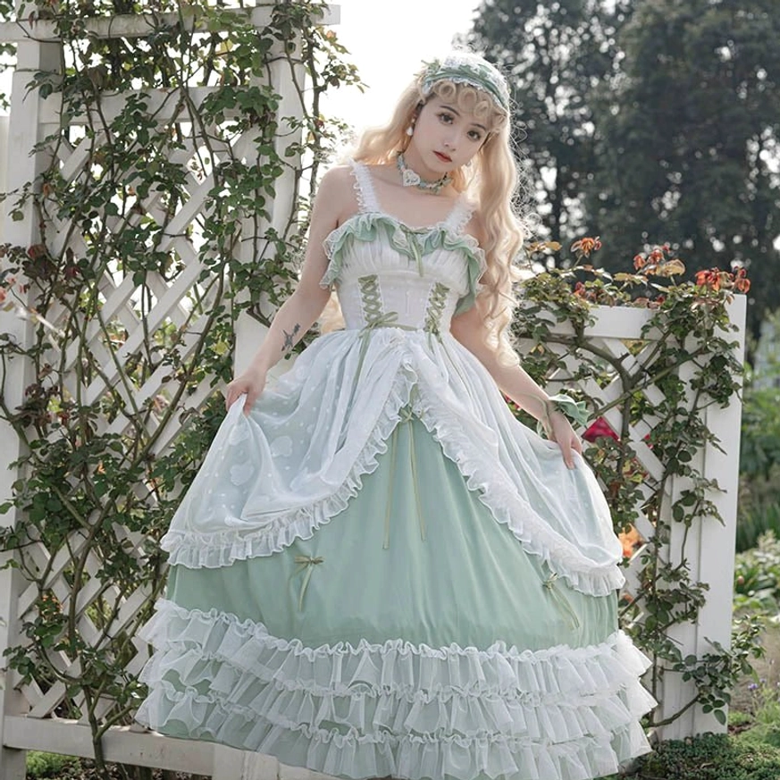 Light blue alternative wedding lolita JSK jumper skirt front full-body view with white lace ruffled trims, corset-style bodice, smooth satin skirt, and garden trellis background